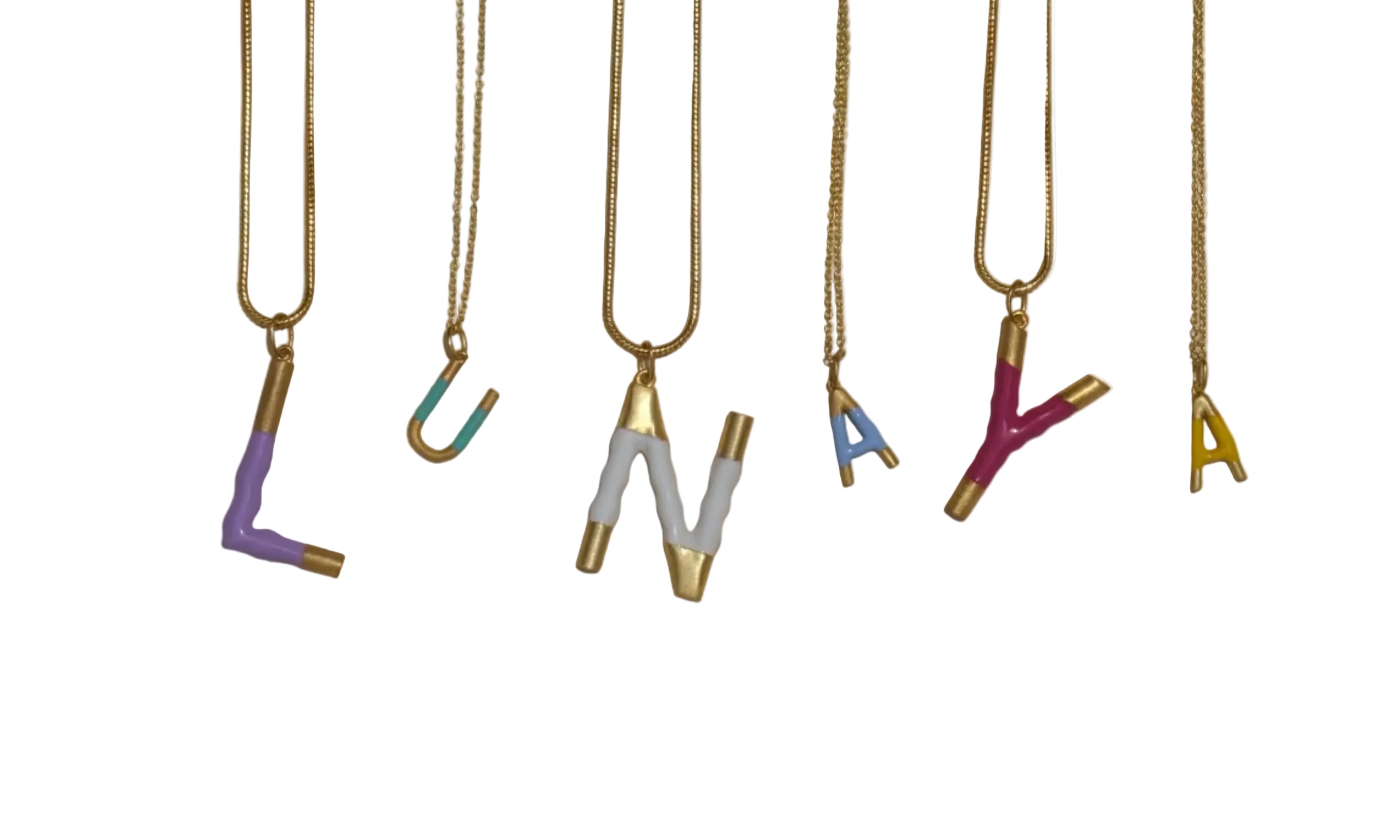Six gold-toned metal jewelry tools, including needles, pins, and small hooks, arranged vertically on a plain beige background.