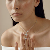 Model wearing the Sitara Lariat Necklace, three falling cubic zirconia stars