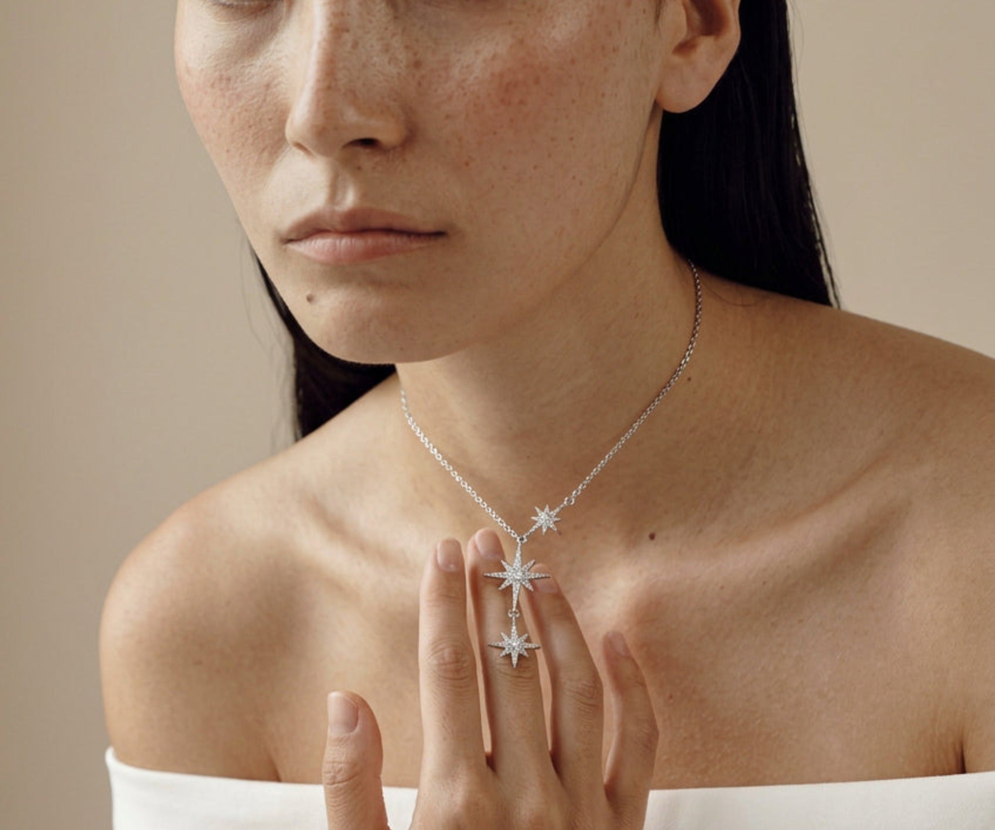Model wearing the Sitara Lariat Necklace, three falling cubic zirconia stars