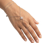 Tara Hand Chain on a hand, layered chain with a cubic zirconia star and finger loop