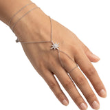 Tara Hand Chain on a hand, layered chain with a cubic zirconia star and finger loop