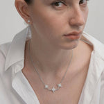 Model wearing the Trio Sitara Necklace with a white shirt
