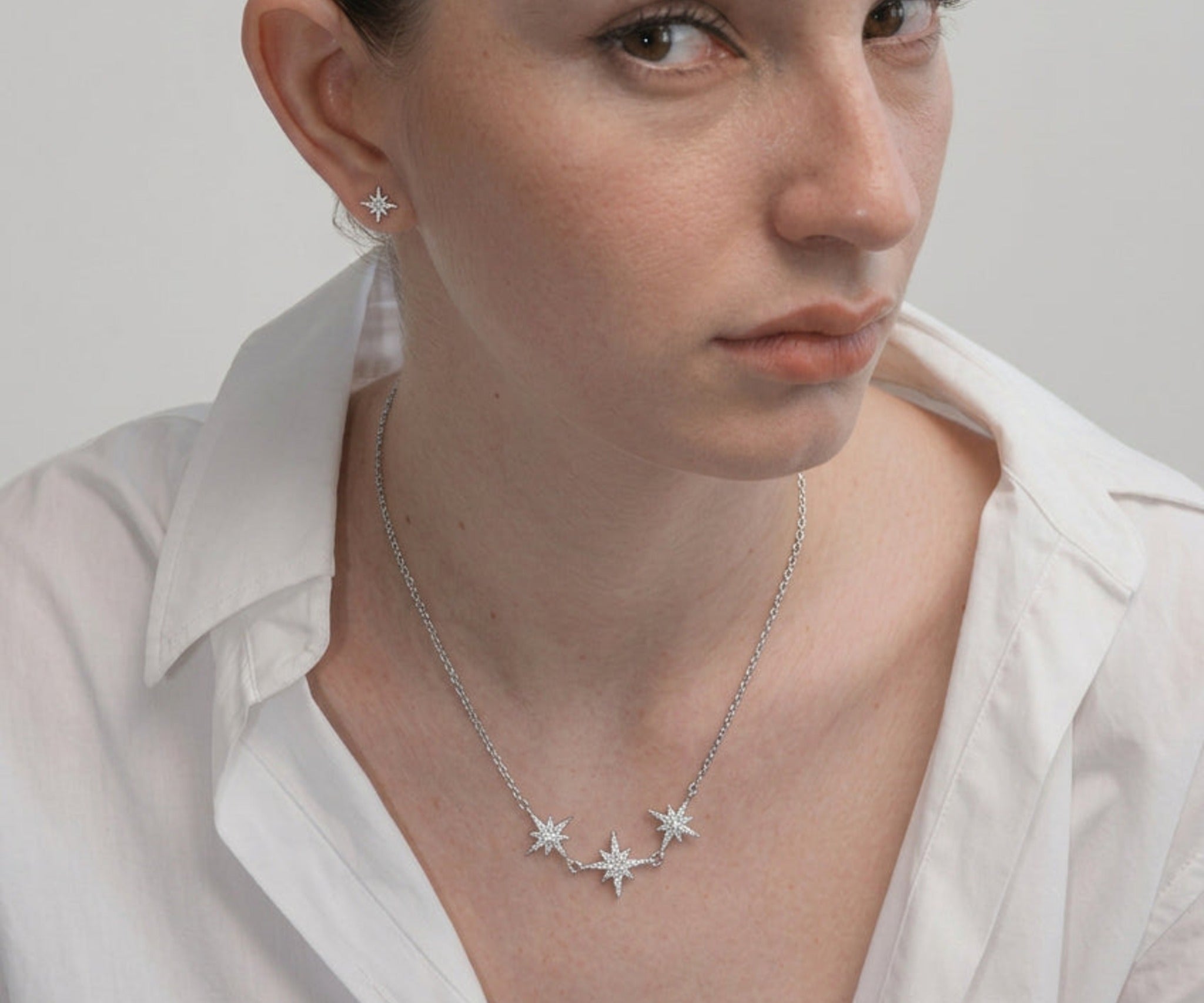 Model wearing the Trio Sitara Necklace with a white shirt